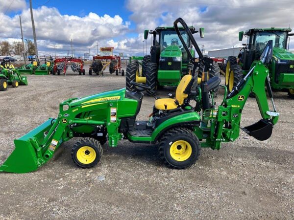 John Deere lawn mower tractor with front loader and backhoe
